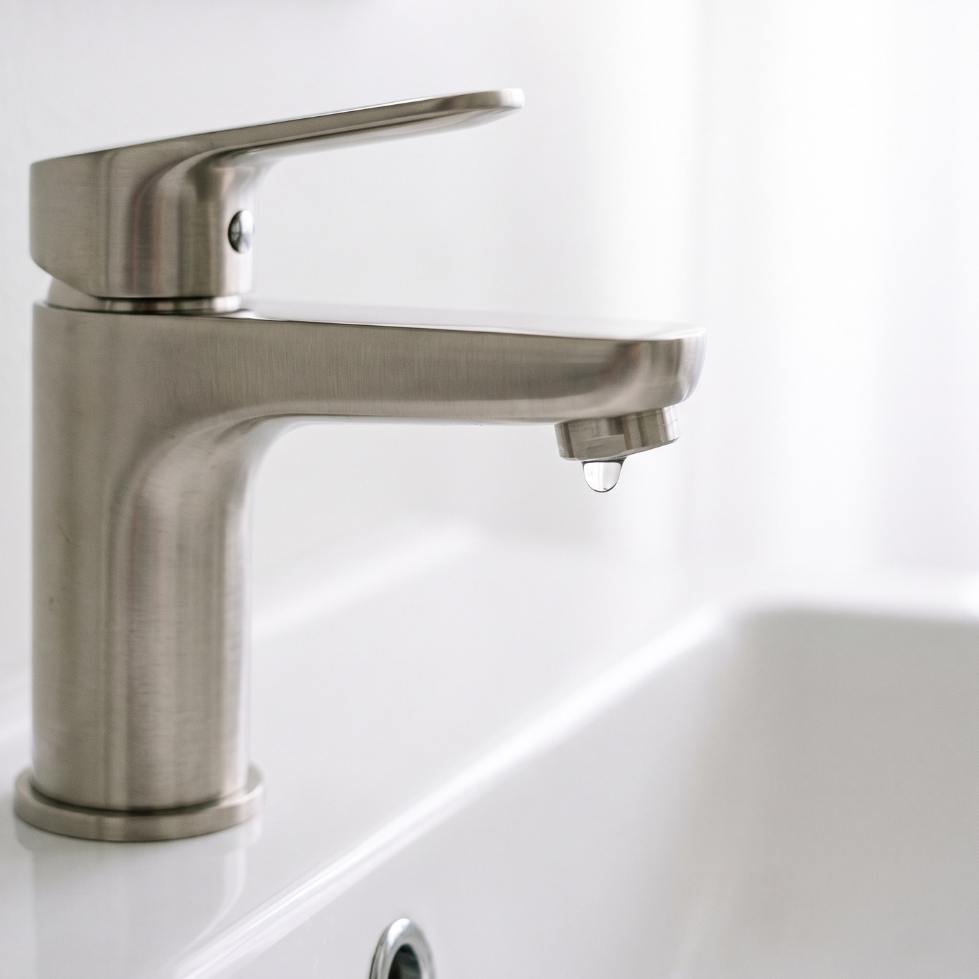 A new brushed-nickel faucet installed clean