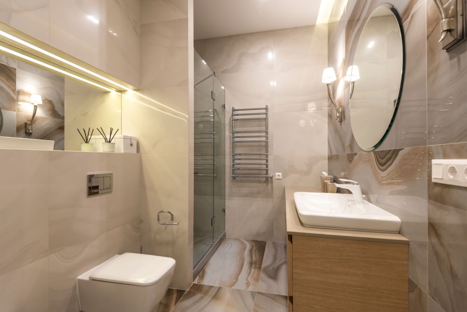 A finished bathroom renovation with new fixtures and chrome hardware