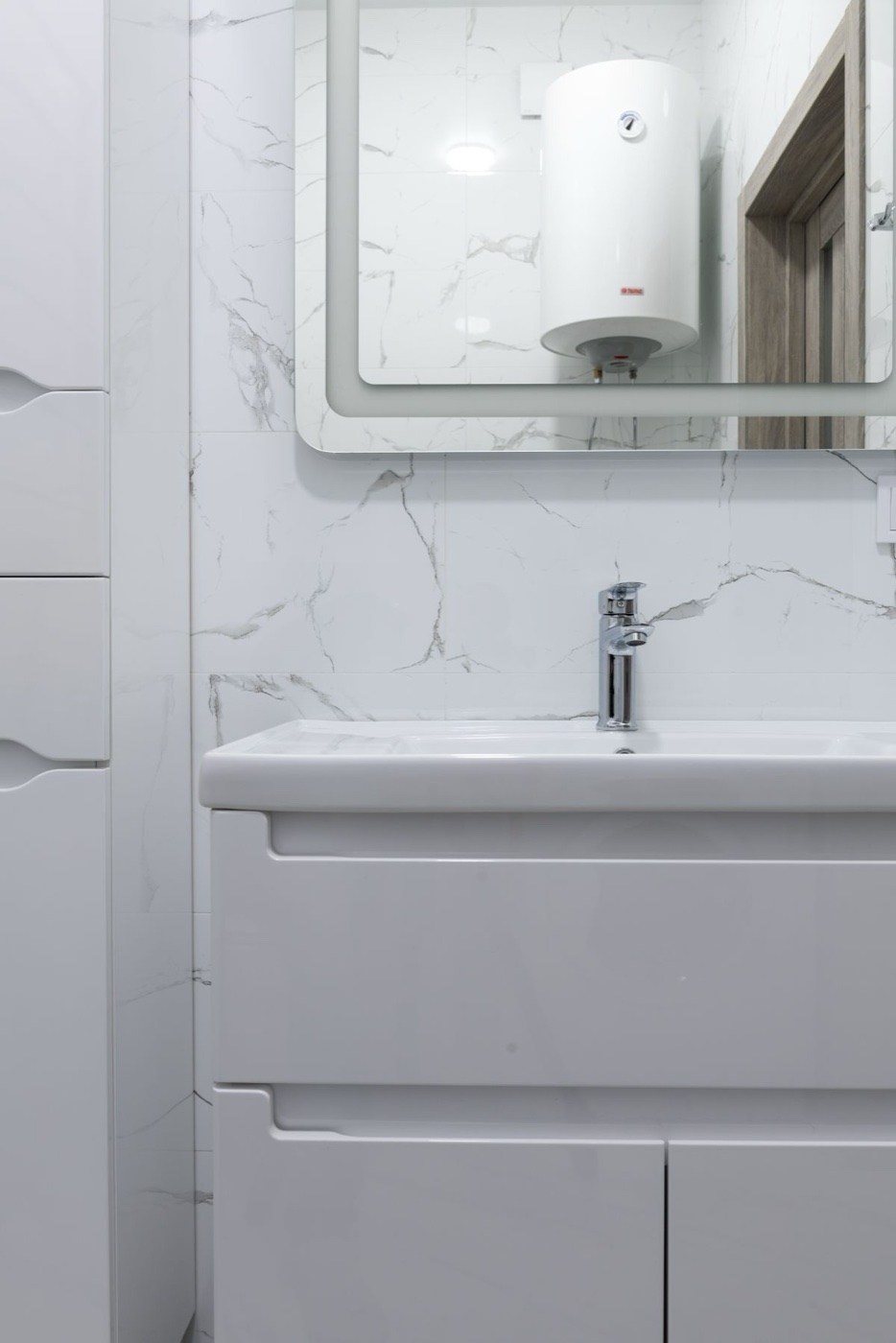 A newly installed brushed-nickel kitchen faucet